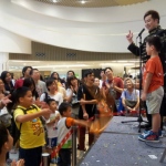 Audience is excited about Wing performing at the popcorn mall.