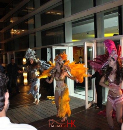 Three Hong Kong Brazilian dancers perform samba at a Hotel 