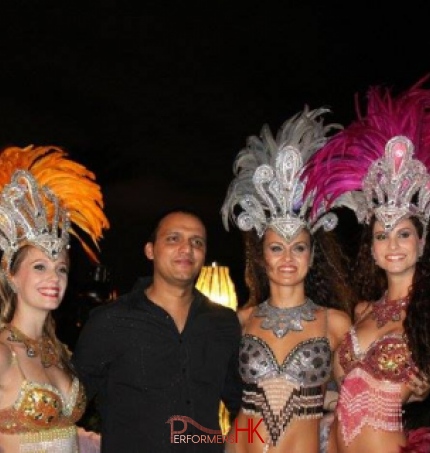 Three Brazilian Dancers Roving meet and greet a gentleman at corporate function for Hong Kong Indian Association