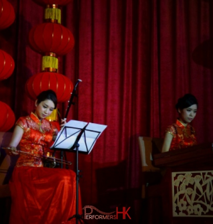 Hong Kong two Chinese music musicians playing Chinese traditional instrument Erhu and Yangqin at a annual dinner
