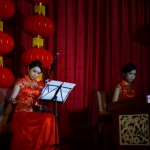 Hong Kong two Chinese music musicians playing Chinese traditional instrument Erhu and Yangqin at a annual dinner