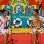 Two HK Chinese music musicians playing Erhu and Pipa at a shopping mall event