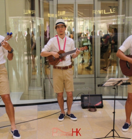 Three Ukulele players performing in Hong Kong shopping mall