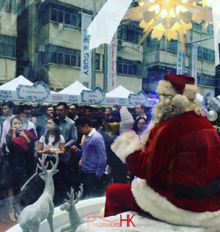 Santa sitting in a glass dome