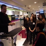 Stewart performing card trick at Sogo Hitachi product launch. 