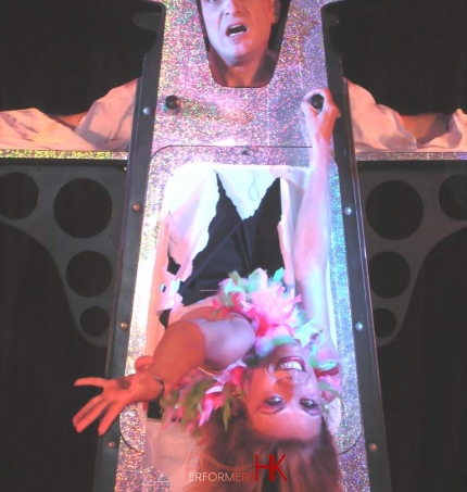 Hong Kong Magician performing his Illusion Show , his assistant getting through his body at a annual dinner