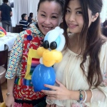Cory with client and her Donal duck balloons.