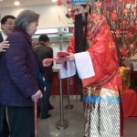 Choi Sun giving out Lai See at Bank of China.