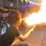 Ling Breathing fire at a street show.