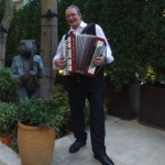 Accordion player at Lee Tung Avenue opening event.