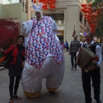 Giant Easter Bunny posing with pedestrians.