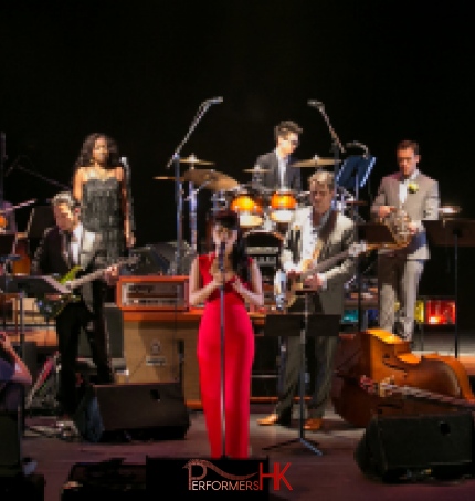 12 piece band photo with singer, violinist, bass player, percussion, keyboard, brass section 