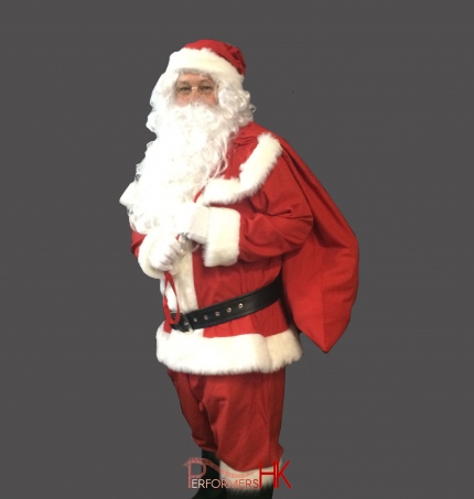 Hong Kong performer dress as Santa , carrying a Santa Bag on his back for a corporate Christmas event.
