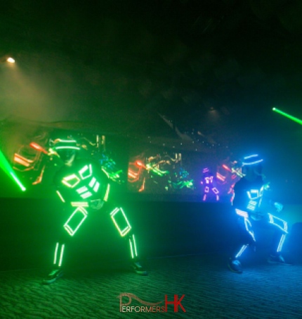Dancers in multi colored LED costumes 