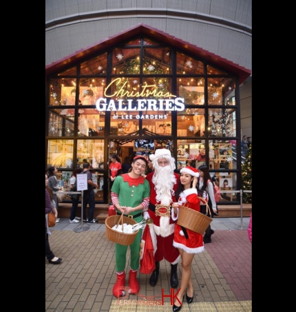 Santa performer with assistants