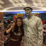 silver man with an attendee at an event