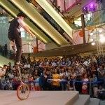 Andy performing for SOGO on his giant unicycle.