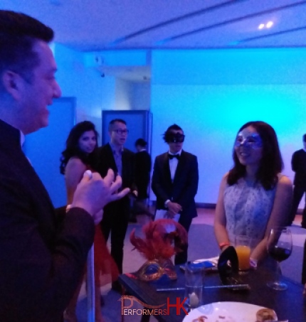 Magician at event with audience members in awe, hong kong sky 100 performance