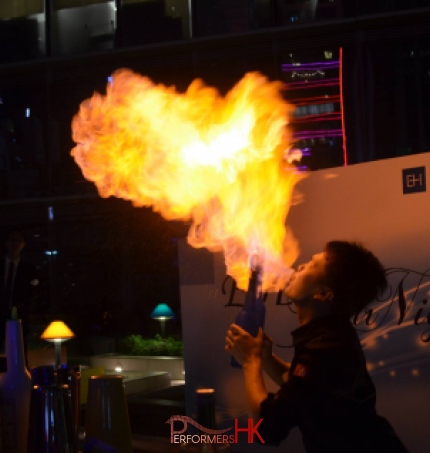 bartender blowing fire at a corporate event mixing cocktails