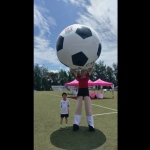 Giant footballs stilts walker at Liverpool sports day Hong Kong