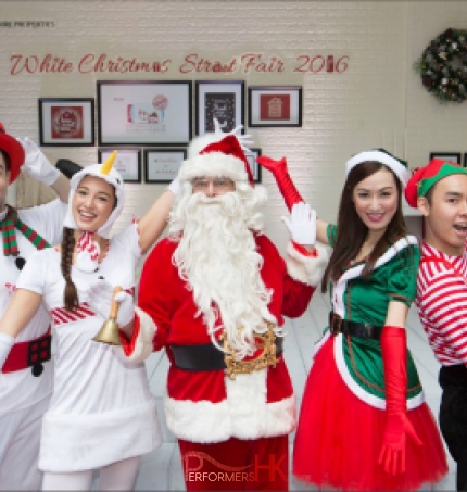 santa taking a photo with elf and snowman character in hong kong 