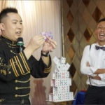 Magic wing money trick with guests
