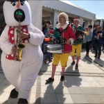 3 different instruments musicians walk around xmas music band in hong kong