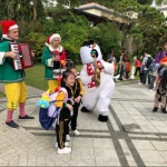 snowman costume character with kids at event 
