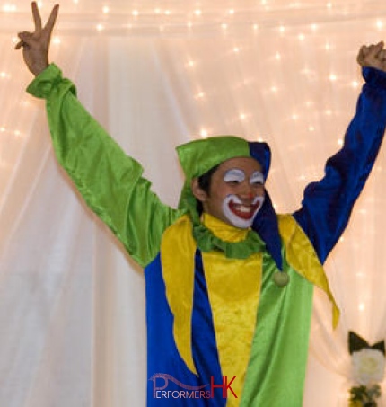 Hong Kong walk around clown juggler holding his both hands up at an event