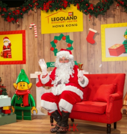 santa sitting in red chair in hong kong legoland tst