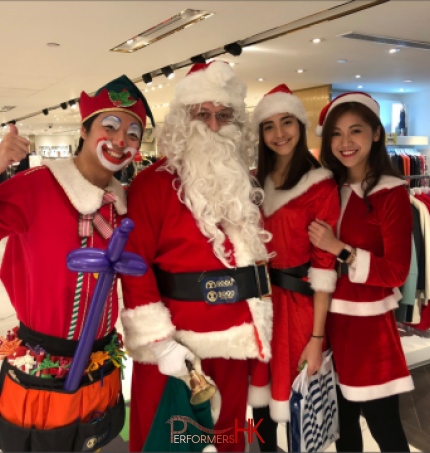 sogo tst performance from performers hk with balloon elf and santa and lady santa all dressed in red