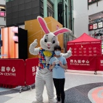 Easter bunny at mall taking photos with kids