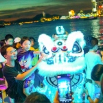 led lion interacting with revellers in wan chai harbourchill hong kong