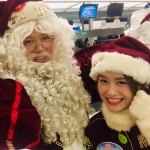 Santa girl Kiwi with Santa Mario on their way out to Finland at HKIA