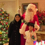 Santa Gerald with some kids at Tsim Tsai Tsui, world famous Peninsula Hotel, December 2024, Hong Kong, HK