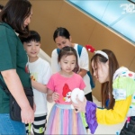 Cory at The Southside mall summer campagin making a small dog for young shopper