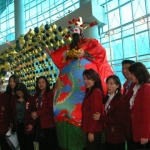 Giant choi sun with guests at Hong Kong International Airport.