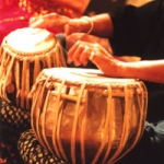 Traditional ethnic instrument player in Hong Kong playing Tabla at a corporate event