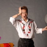 Andy performing his famous needle through a balloon magic trick.