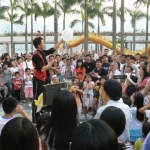 Street Magic at Tsim Sha Tsui attracting a large crowd.