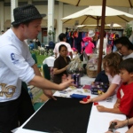 Magician Andy entertaining children at Repulse Bay. 