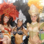 Three exotic Samba dancers posing in their gorgeous costumes at Hong Kong Rugby Sevens.