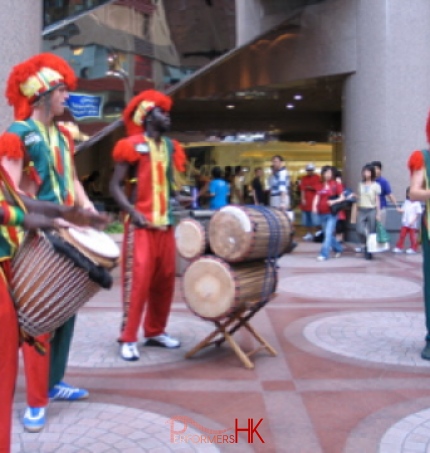 African drummer in colorful costumes in Causeway Bay HK